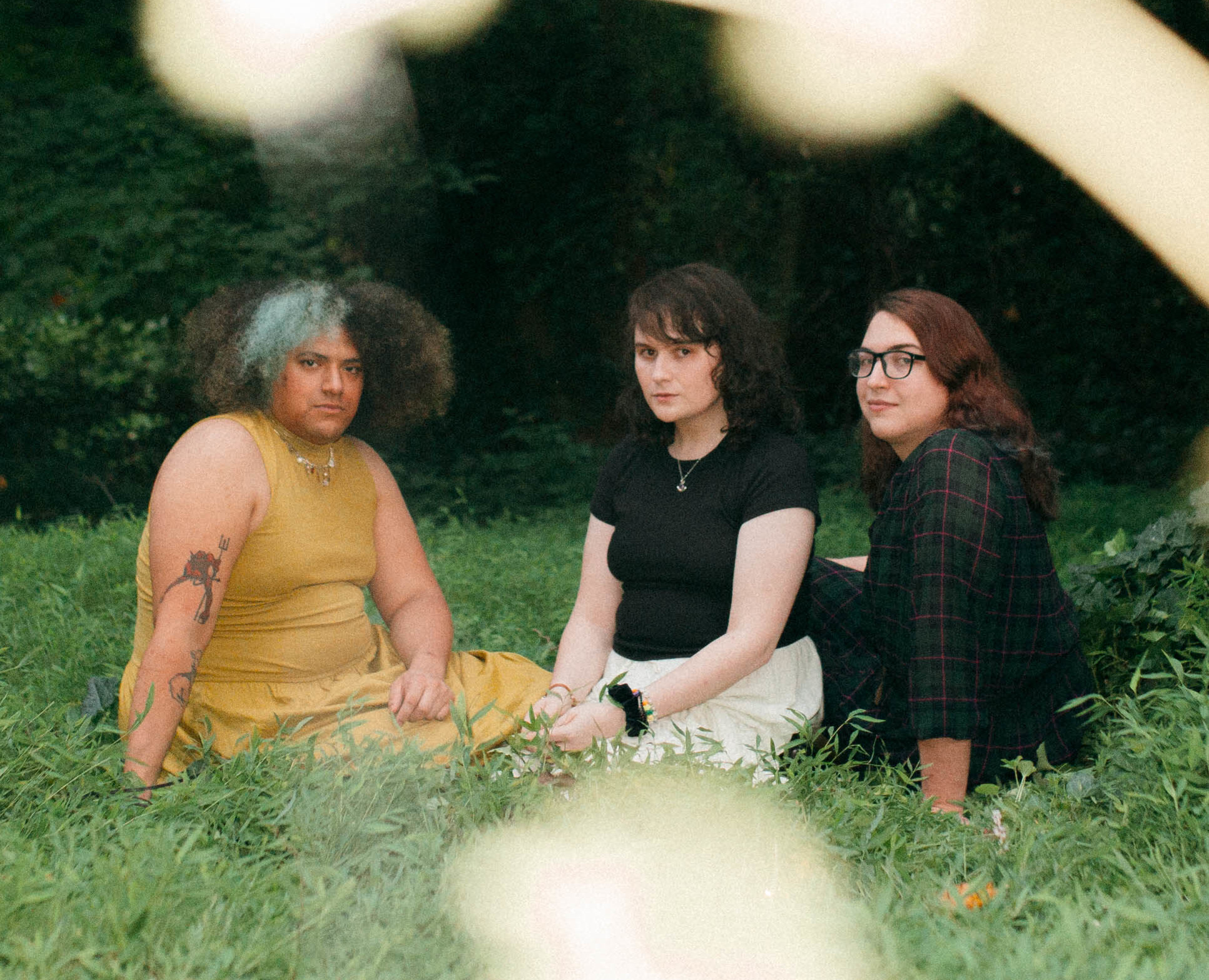 A band picture of the three of us in the ethereal glow of nature